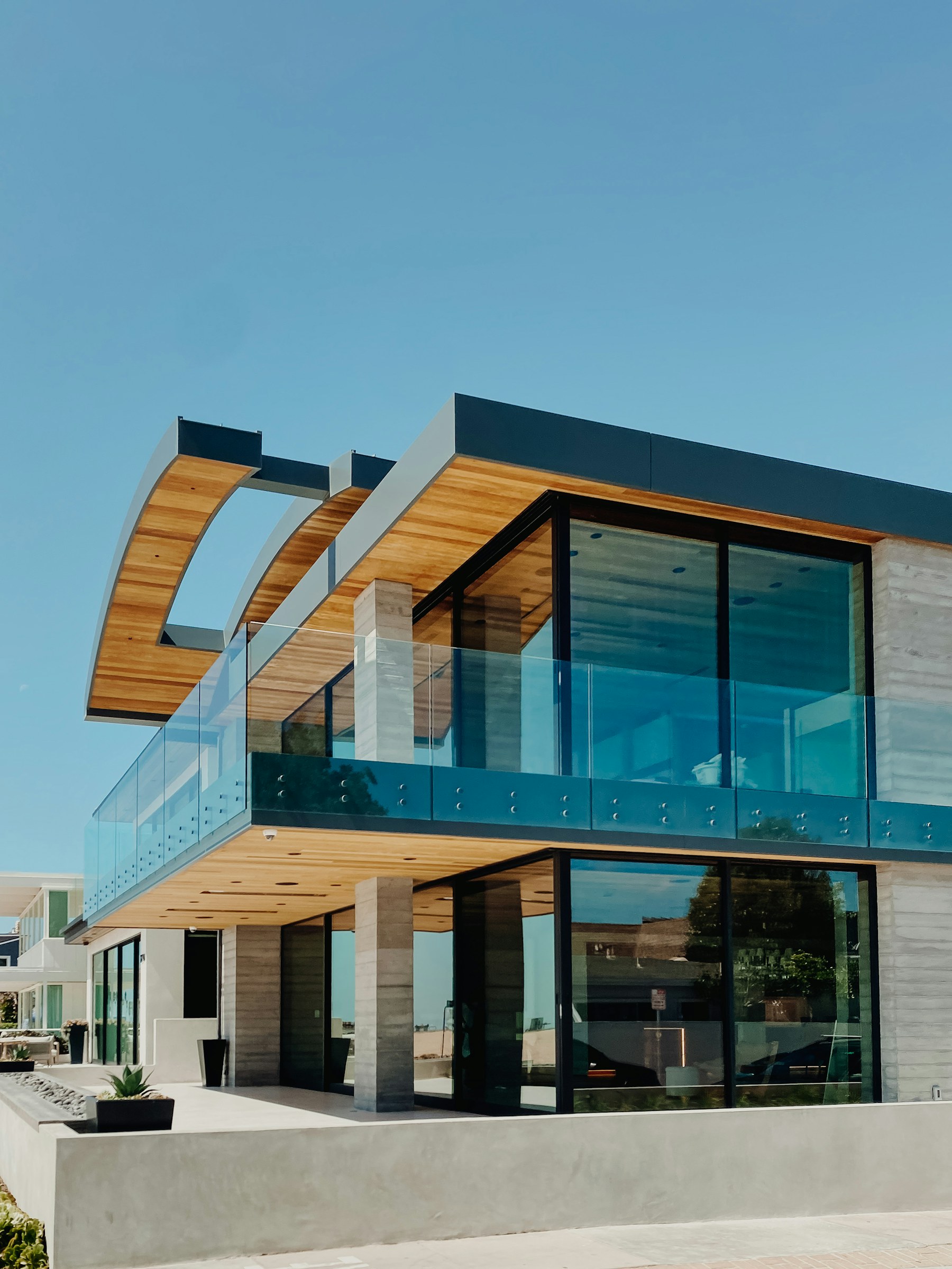 Contemporary coastal residence with timber soffits and expansive glass