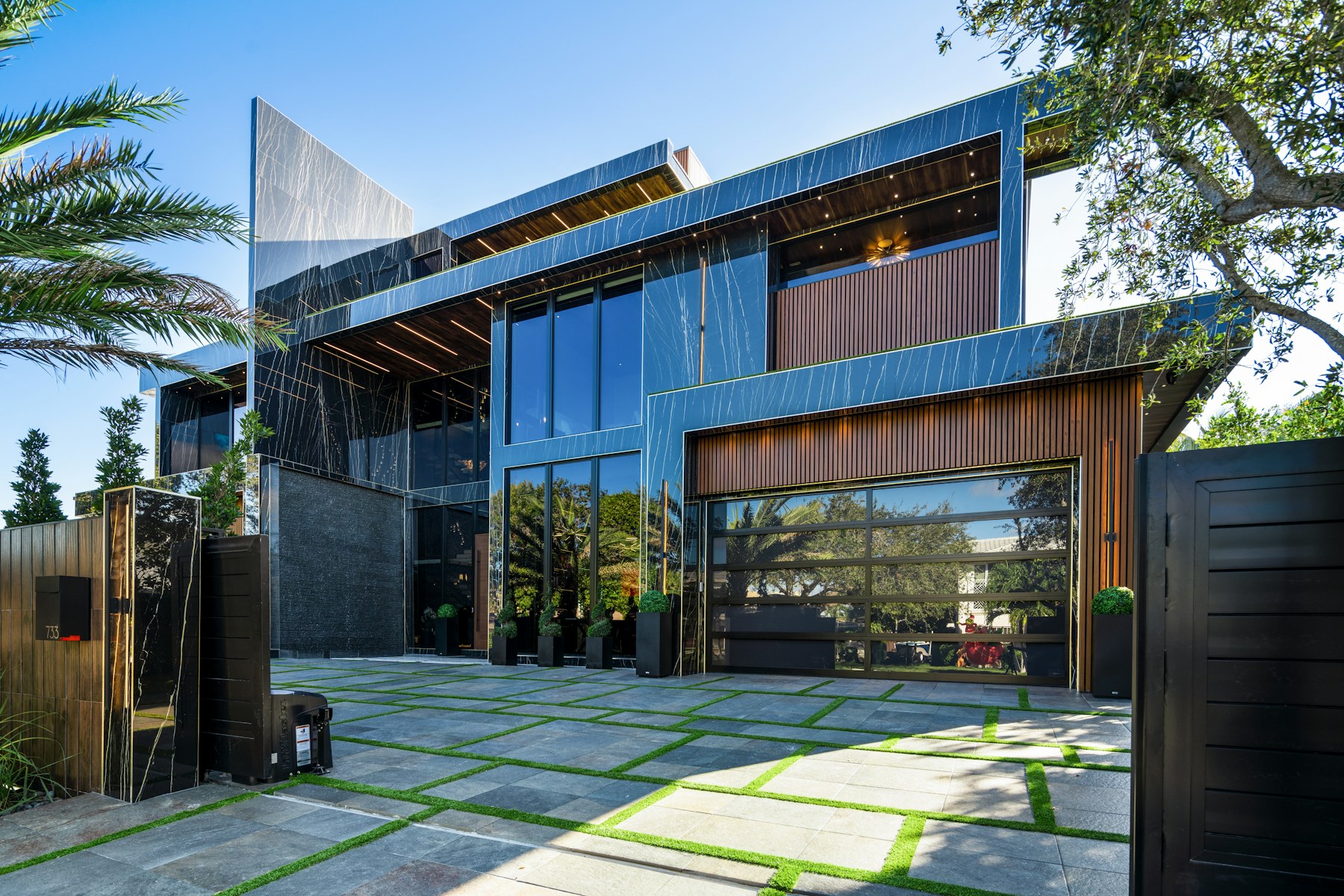 Modern residence framed by mature California landscaping